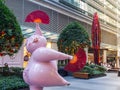 Cute pink pig sculpture with funny posture to celebrate year of the pig at World square building.